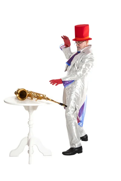 Magician with trumpet shows magic trick — Stock Photo, Image