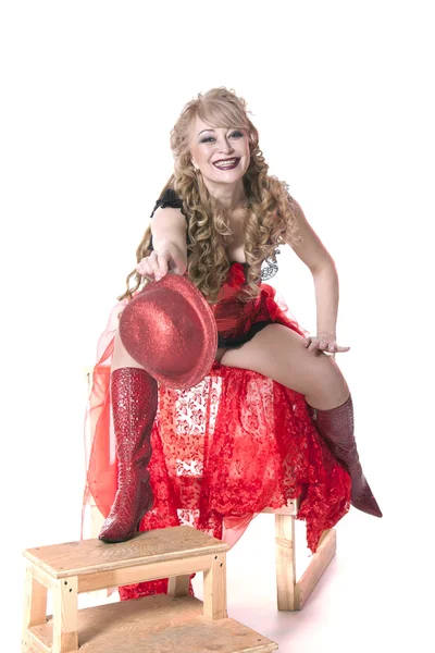 Actress in a red dress and hat — Stock Photo, Image