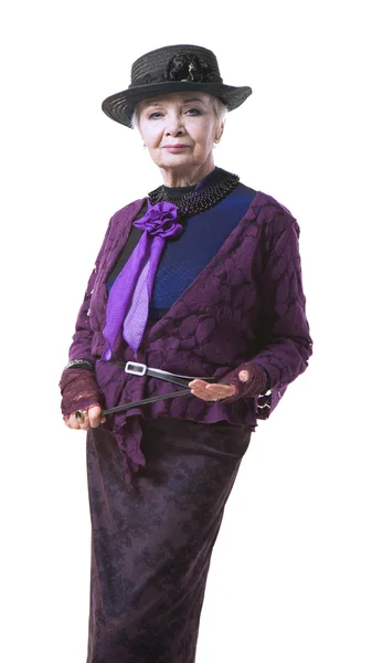 Starší žena v klobouku s ukazatelem — Stock fotografie