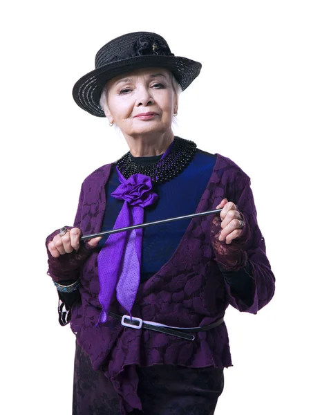 Elderly woman in a hat with a pointer — Stock Photo, Image