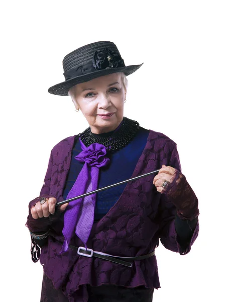 Elderly woman in a hat with a pointer — Stock Photo, Image