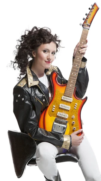 Girl   sitting on the chair with  electro guitar — Stock Photo, Image