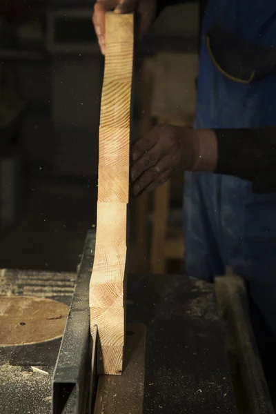 Man cutting wood by circular saw blade — Stock Photo, Image