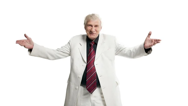 Mature businessman shows a greeting sign — Stock Photo, Image