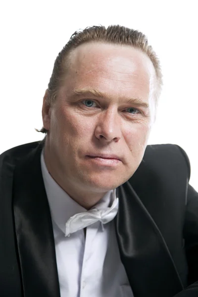 Portrait of a man in a suit and bow tie — Stock Photo, Image