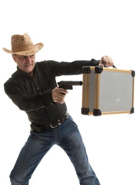 Человек с пистолетом и футляром — стоковое фото
