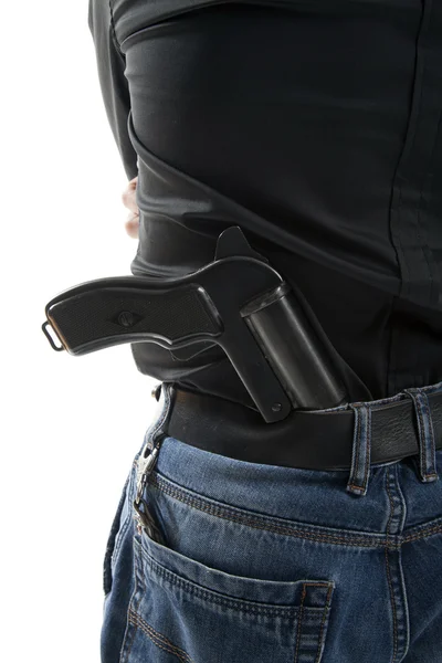 Man med en pistol bakom hans rygg — Stockfoto
