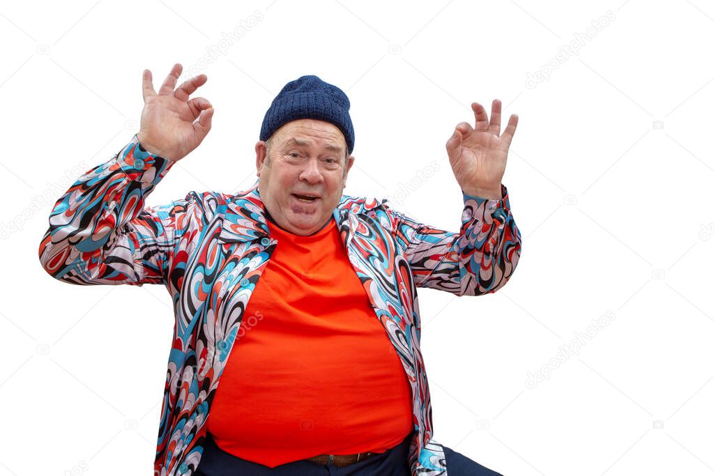 A cheerful and extravagant grandfather in a sports cap entertains, laughs and shows an o kay gesture!