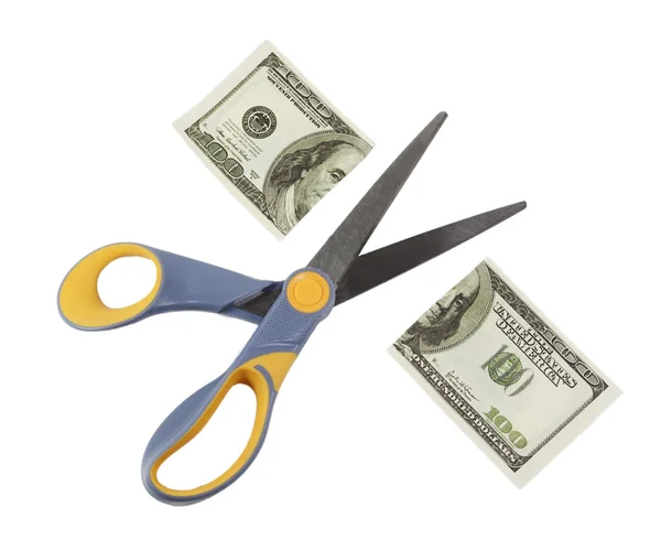 Scissors cut a hundred dollar bill in half — Stock Photo, Image