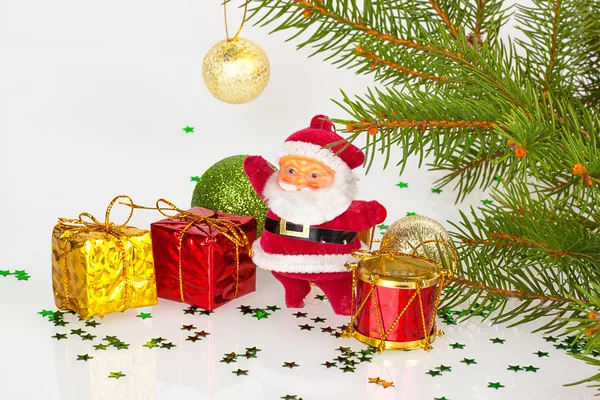 Santa claus with gifts and red drum — Stock Photo, Image