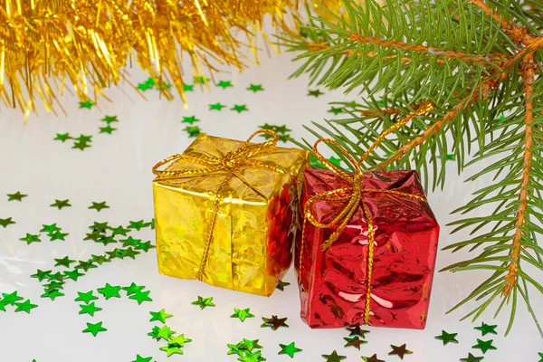 Two Christmas gifts under the tree — Stock Photo, Image