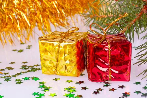 Two Christmas gifts under the tree — Stock Photo, Image