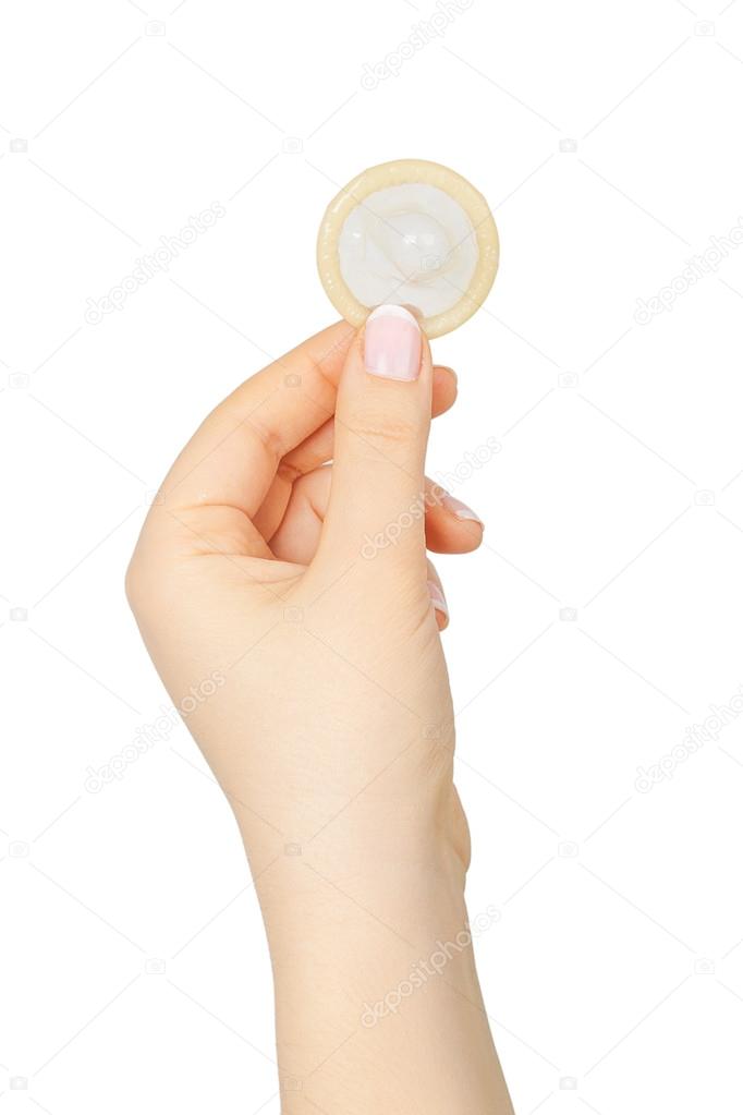 Female hand holding condom