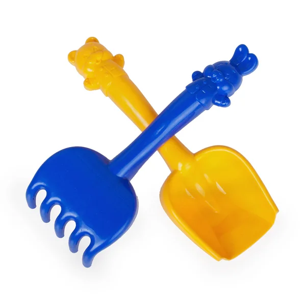 Plastic shovel and rake — Stock Photo, Image