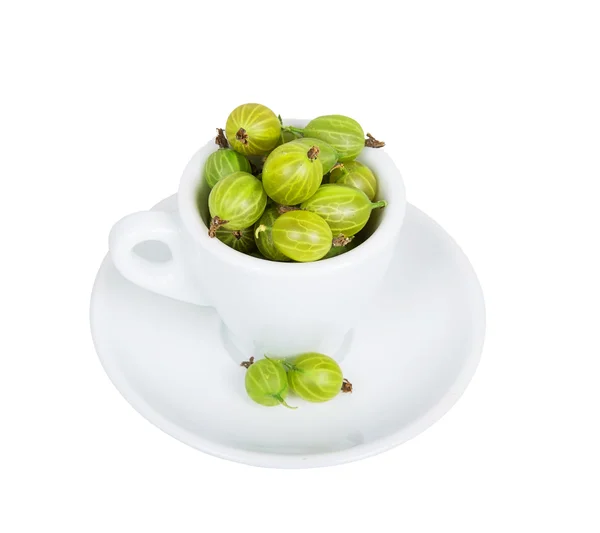 Gooseberries in white cup and saucer — Stock Photo, Image