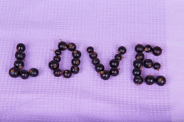 The word "love" of black currant — Stock Photo, Image