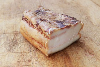 Bacon on wooden base