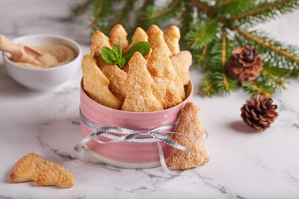 Cookies in a shape of Christmas trees covered with brown sugar. — Stock Photo, Image