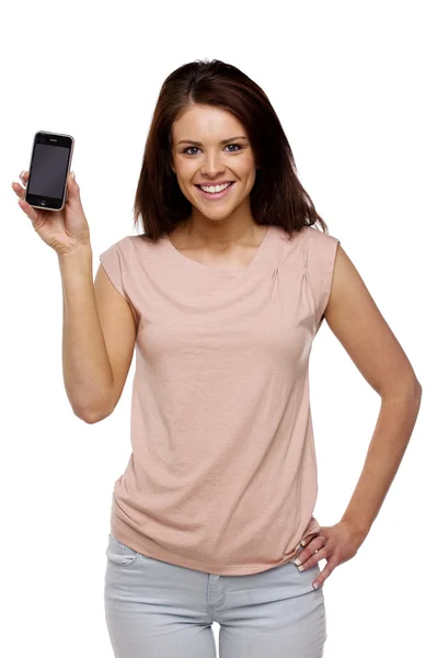 Brunette woman showing the screen of a mobile phone — Stock Photo, Image