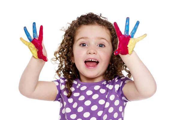 Jong meisje met geschilderde vingers geïsoleerd op een witte achtergrond Stockfoto