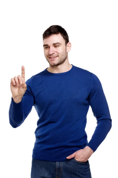 En kjekk mann som peker eller trykker på en knapp – stockfoto