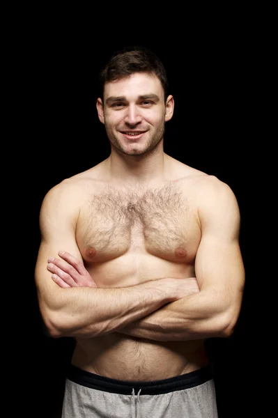 Topless man isolated on a black background — Stock Photo, Image