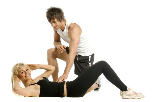 Hombre entrenamiento mujer aislado en un fondo blanco — Foto de Stock