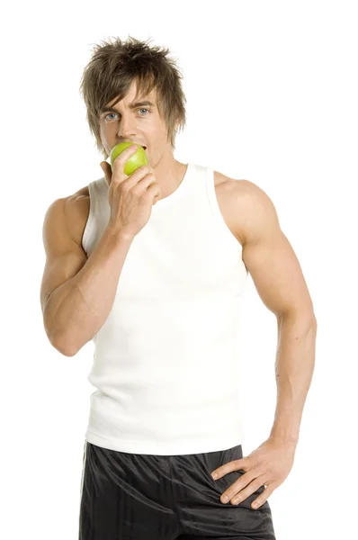 Man biting into an apple isolated on a white background — Stock Photo, Image