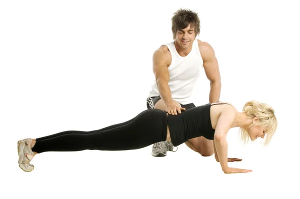 Hombre entrenamiento mujer aislado en un fondo blanco —  Fotos de Stock