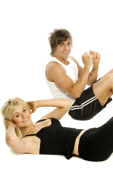 Man and woman working out isolated on a white background — Stock Photo, Image