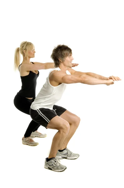 Man and woman working out isolated on a white background — Stock Photo, Image