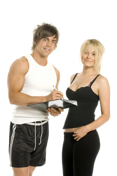 Hombre y mujer llenando formularios aislados sobre un fondo blanco —  Fotos de Stock