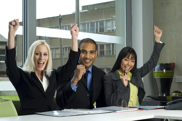 Three colleagues cheering in a meeting — Stock Photo, Image