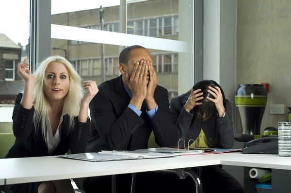 Stressed work colleagues in a meeting — Stock Photo, Image