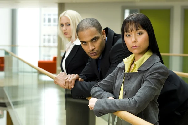 Work colleagues in modern office building — Stock Photo, Image