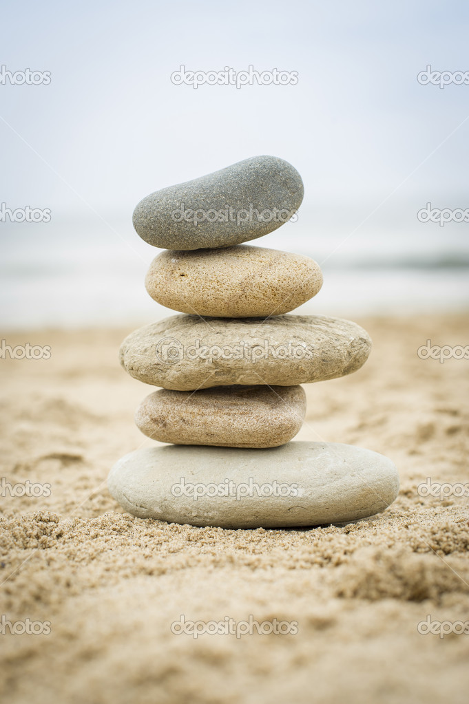 Stones piled up on a sand beach — Stock Photo © firstbite 32120505