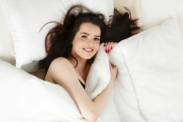 Woman laid in bed looking up — Stock Photo, Image