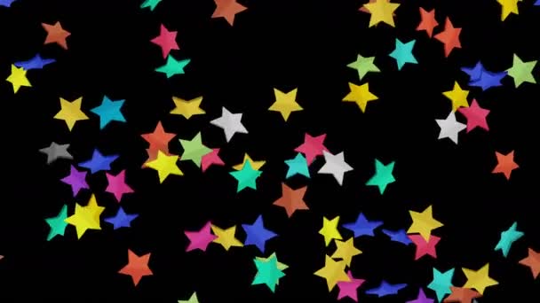 Багато Барвистих Зірок Плавають Повітрі Чорному Тлі Зоряні Ікони Вибухові — стокове відео