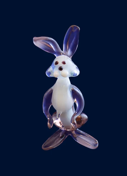 Glass rabbit on blue — Stock Photo, Image