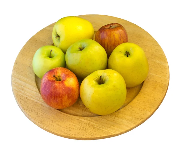 Apples on wooden plate — Stock Photo, Image