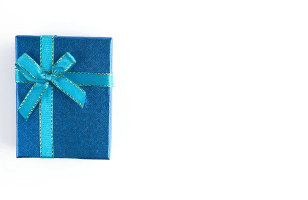 Blue gift box with ribbon for Christmas, New Year, birthday on white background — Zdjęcie stockowe