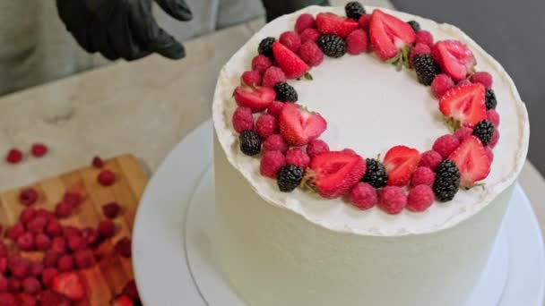 Pastry Chef Woman Making Cake Fresh Berries Rotating Table High — Stock Video