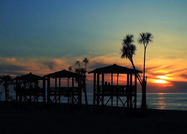 Sonnenuntergang am Strand lizenzfreie Stockfotos
