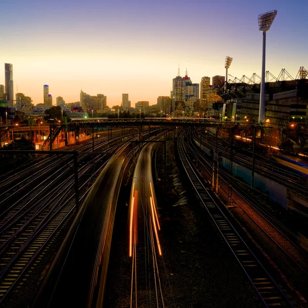 Trains heading past the MCG — Stock Photo, Image