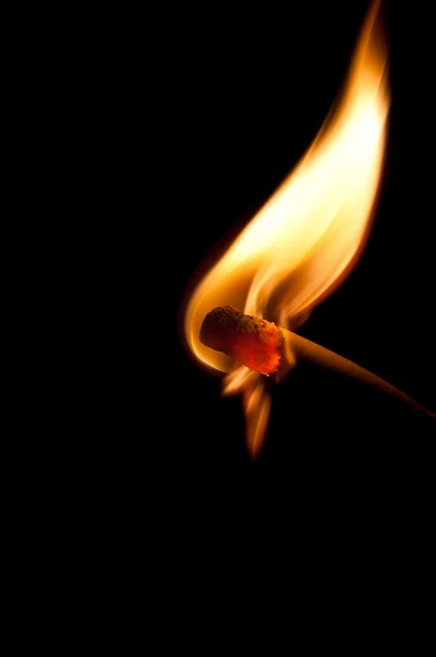 Burning match on black background — Stock Photo, Image