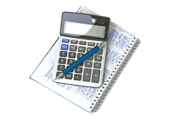 Miniräknare, anteckningsbok och penna på vit bakgrund Royaltyfria Stockfoton