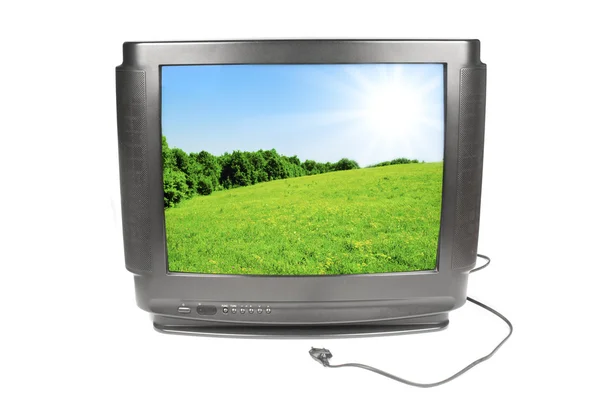 Зеленый луг на старом экране телевизора — стоковое фото