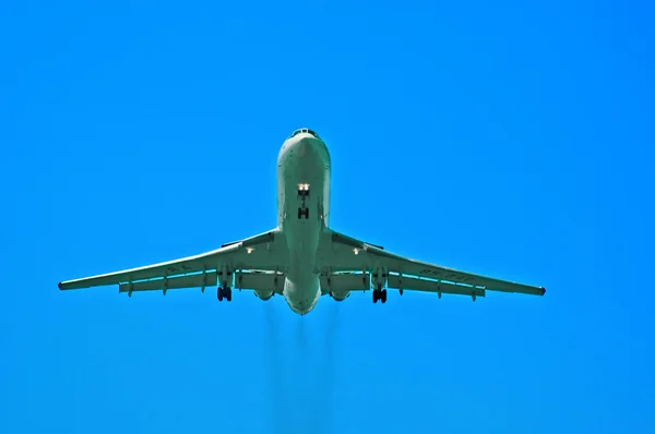Plane in blue sky — Stock Photo, Image