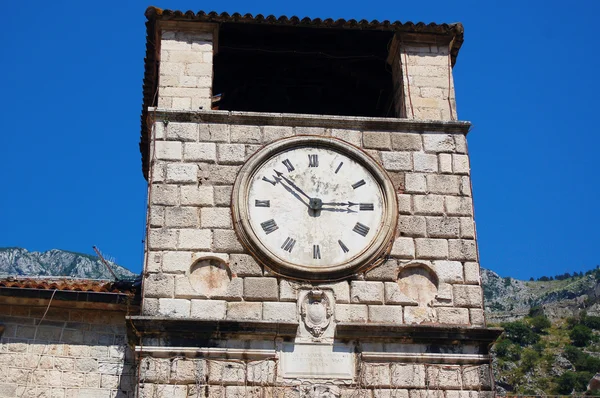 Stone clock at medieval tower in Kotor, Montenegro — Stock Photo, Image