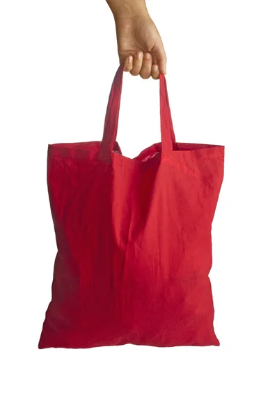 Saco de compras vermelho na mão — Fotografia de Stock